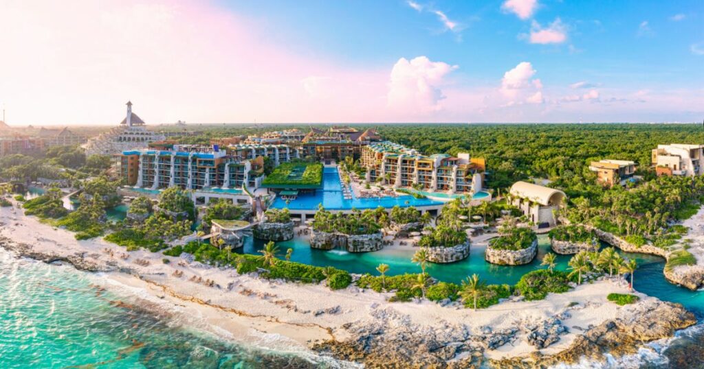 Shutterstock Aerial tour over a luxurious 5-star hotel resort next to the beautiful beaches of Cancun with sunny weather