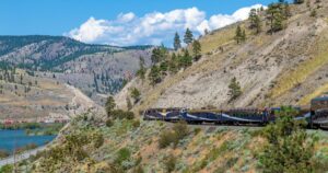 Rocky mountaineer train along the Fraser River in summer, British Columbia.