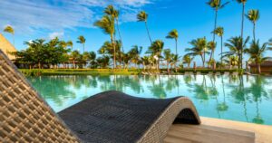 Swimming pool and palm trees in luxury resort at Pun Cana in the Dominican Republic