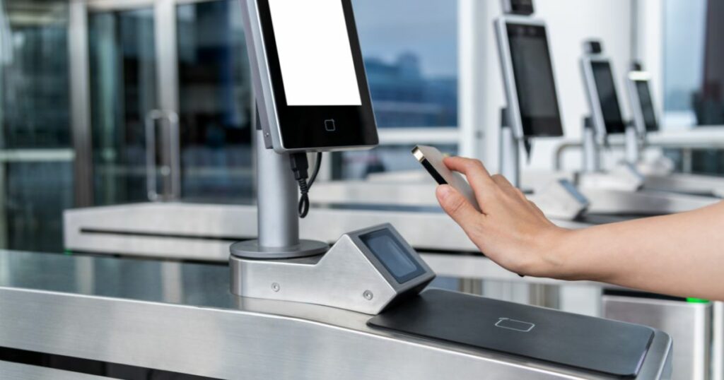 Shutterstock A person scanning mobile phone id at airport check point