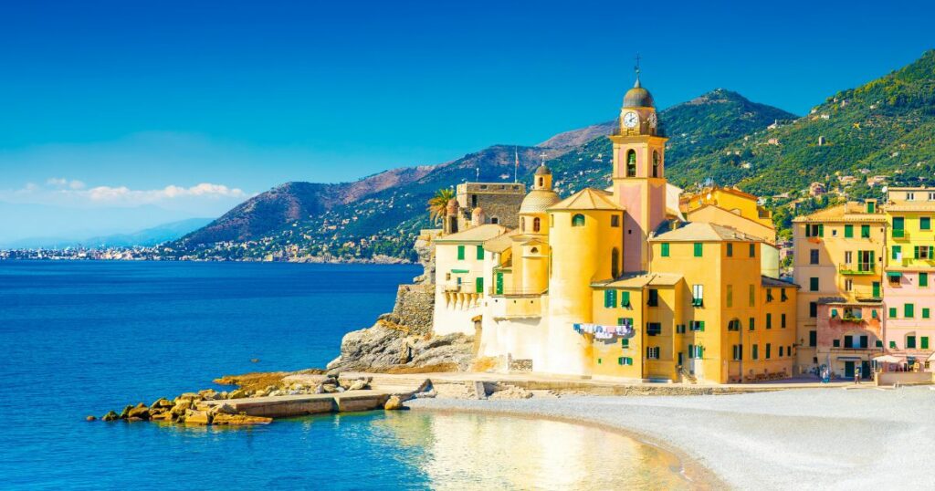 Shutterstock Scenic Mediterranean riviera coast. Panoramic view of Camogli town in Liguria, Italy. Basilica of Santa Maria Assunta and colorful palaces. Liguria, Italy