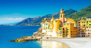Scenic Mediterranean riviera coast. Panoramic view of Camogli town in Liguria, Italy. Basilica of Santa Maria Assunta and colorful palaces. Liguria, Italy