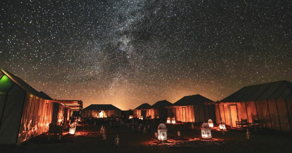 Shutterstock Wonderful starry night in the middle of Moroccan Sahara desert and desert luxury camps