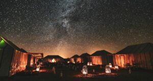 Wonderful starry night in the middle of Moroccan Sahara desert and desert luxury camps