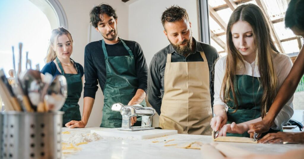 Shutterstock People learning to make ravioli in Italian cooking class