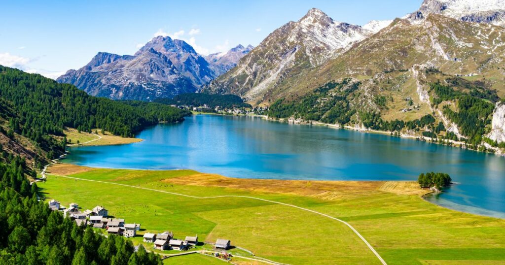 Shutterstock Upper Engadine, Lake Sils, and the village of Isola, photographed from above in summer.