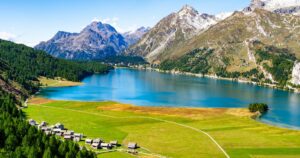 Upper Engadine, Lake Sils, and the village of Isola, photographed from above in summer.