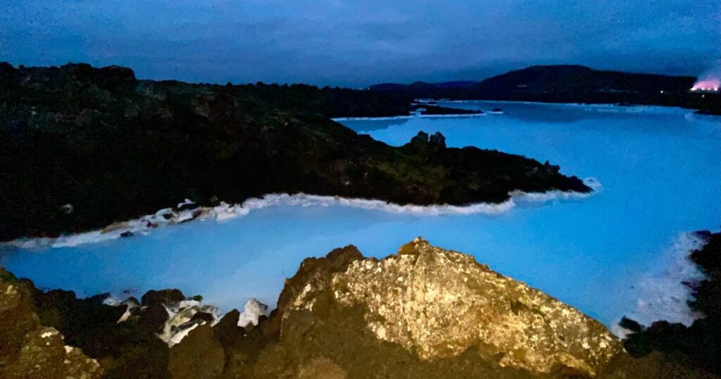 Shutterstock Grindavik, Iceland, October 25th 2021: A stunning view of the Blue Lagoon’s geothermal waters under the evening sky, framed by rugged volcanic rock formations and the ethereal blue glow.