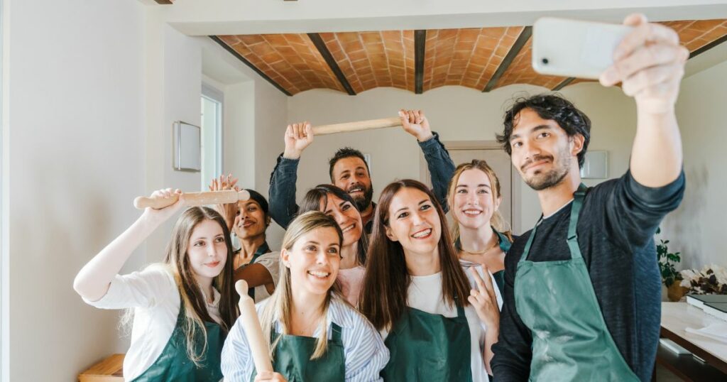 Shutterstock A group of friends taking a selfie in their cooking class