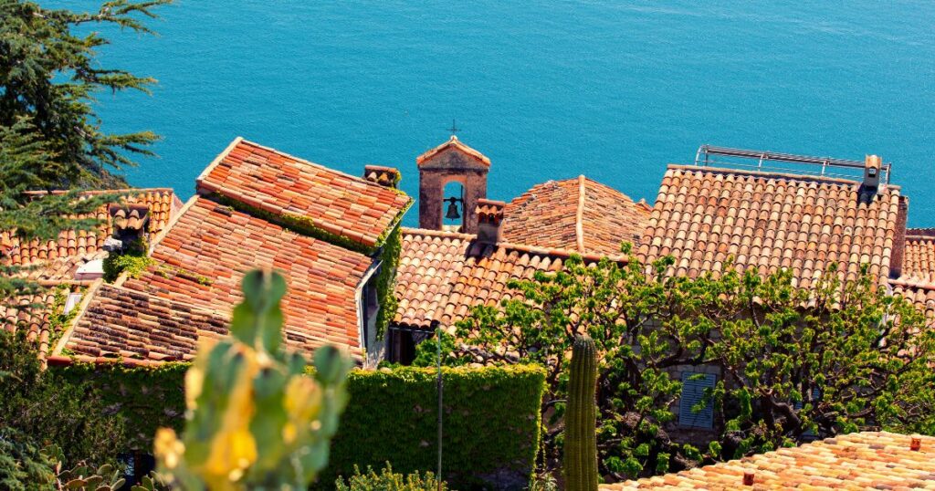 Shutterstock Medieval village Èze in France. Old houses with tiled roofs against the backdrop of the sea. Horizontal banner