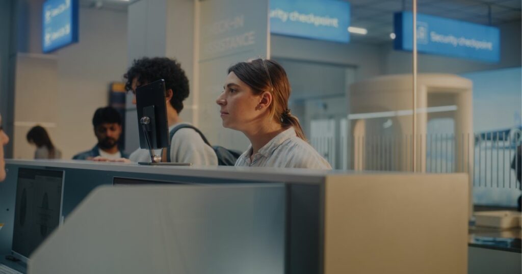 Shutterstock A woman looking into the camera for facial recognition at airport