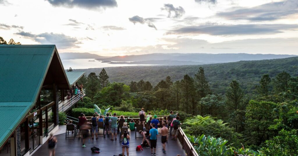 Shutterstock Tourists and guides enjoying the sunset from the Observatory Lodge