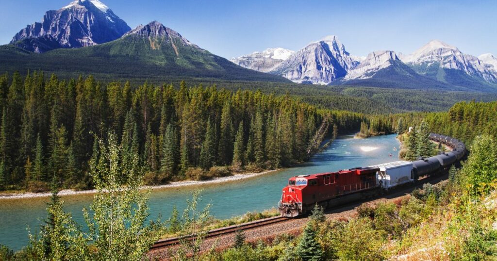 Shutterstock Train passing through Bow valley under the surveillance of mighty Rocky Mountains