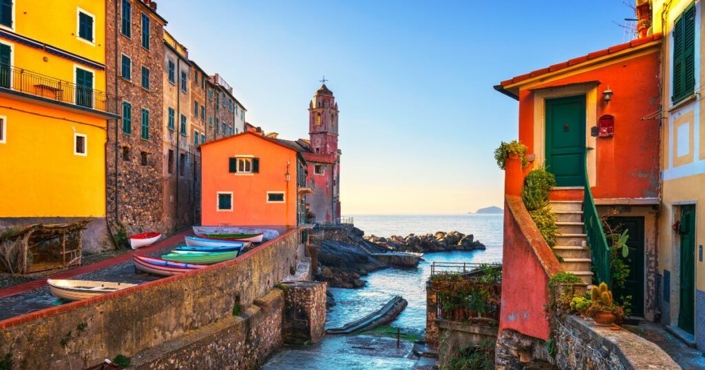 Shutterstock Tellaro sea village street, church and boats. Five lands, Cinque Terre, Liguria Italy Europe.