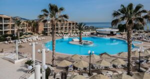 AMOUDARA, CRETE - MAY 12, 2017: TUI Magic Life Candia Maris resort (285 rooms and suites) on beach of Amoudara, very close to city center of Heraklion and International airport. Wonderful area.