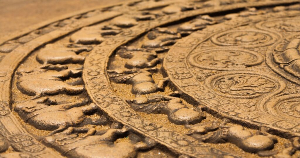 A ground carving at the entrance to the Vatadage is a moonstone relief depicting the cycle of sansara in the ruins of ancient capitol of Polonnaruwa, Sri Lanka. Side