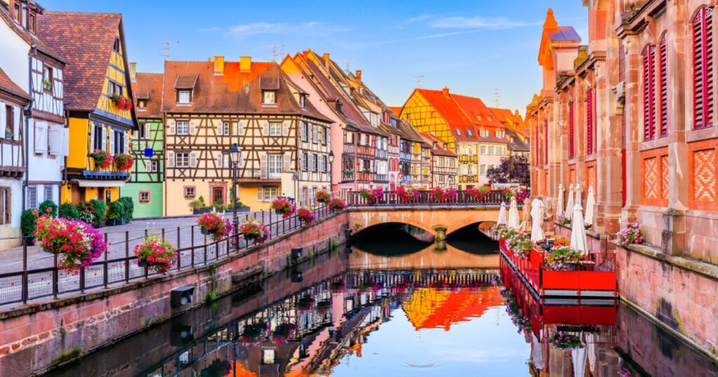 View with colorful buildings, canal and flowers. Colmar, France. Petite Venice