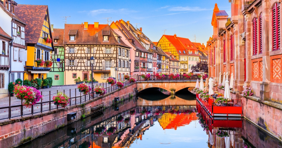 View with colorful buildings, canal and flowers. Colmar, France. Petite Venice