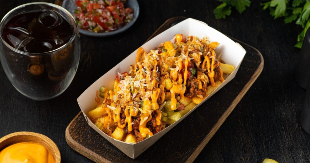Original Canadian Poutine, Skin On Fries Topped With Gravy And Cheese Curds In Cardboard Box