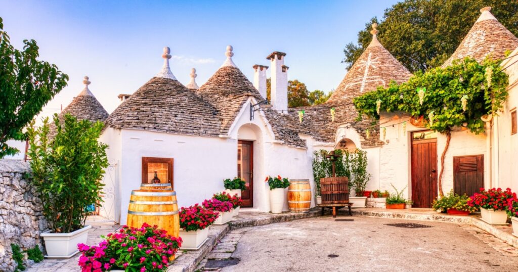 Famous Trulli Houses during a Sunny Day with Bright Blue Sky in Alberobello, Puglia, Italy