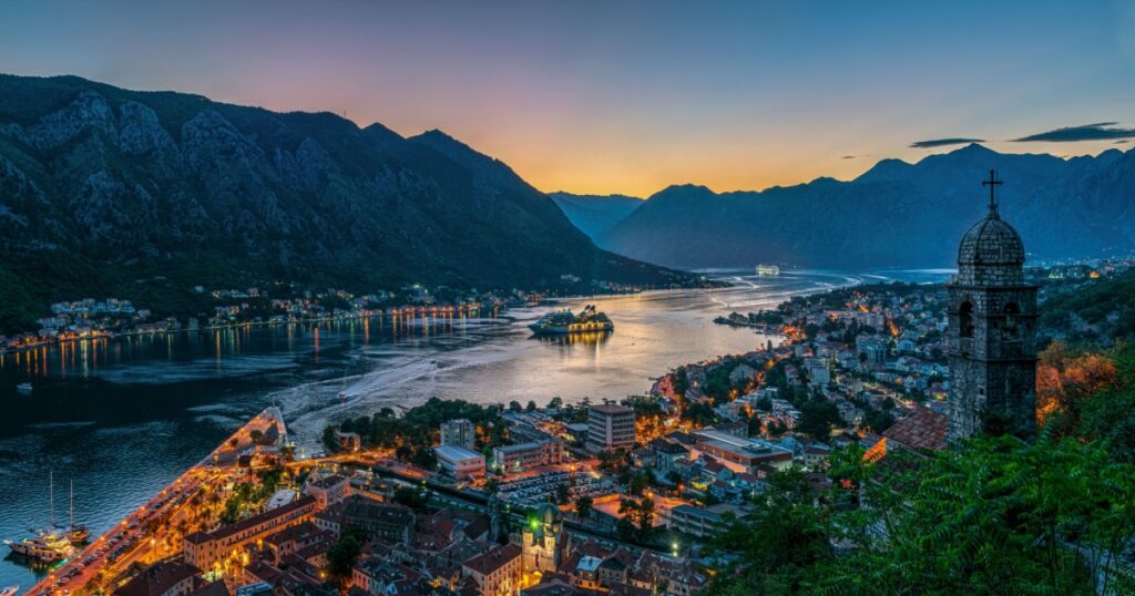 Panoramic evening view of the church, old town and the Bay of Kotor from above.