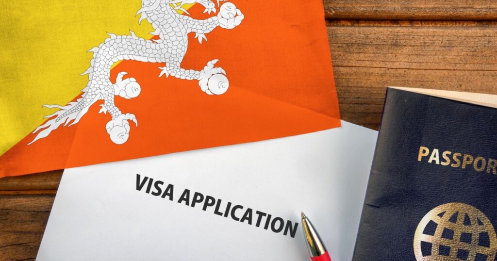 Visa application form, passport and flag of Bhutan