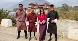 Punakha, Bhutan - March 13th 2024 - Near Punakha Dzong, tourist drivers and guides wear traditional dress - gho for men, kira for women..