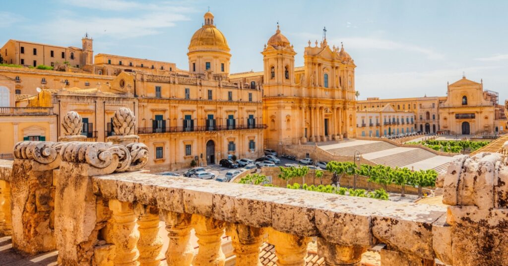 View in Noto, with the Basilica Minore di San Nicolo and Palazzo Ducezio, Sicily, Italy.