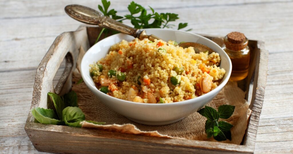 Couscous with shrimps and vegetables in a bowl