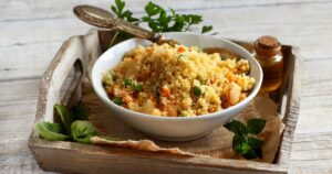 Couscous with shrimps and vegetables in a bowl
