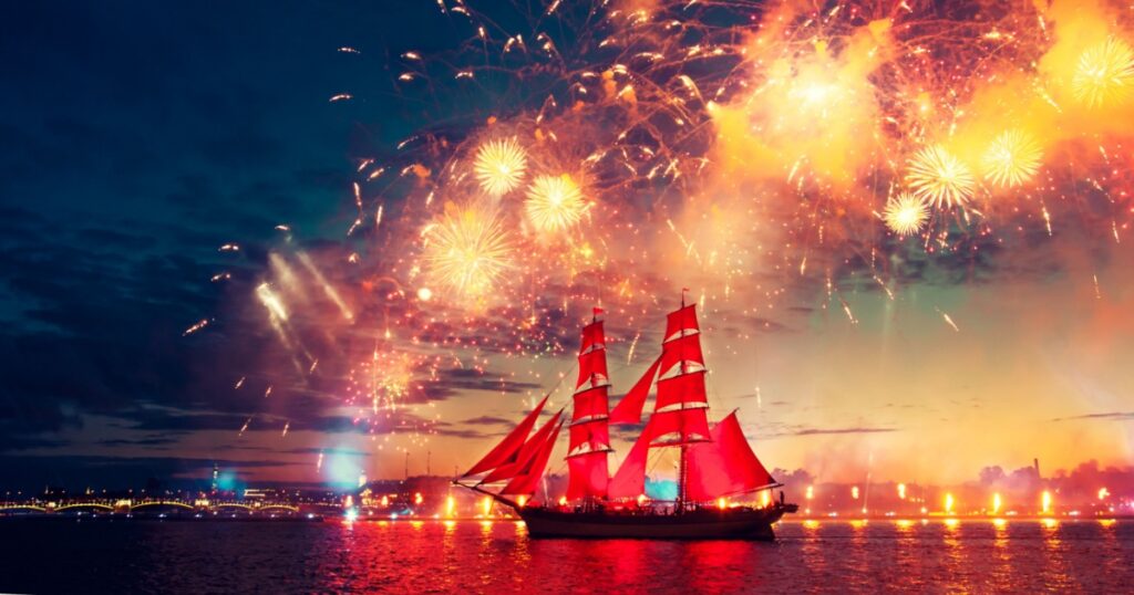 Miracle night show in St. Petersburg. Colorful fireworks and a ship with scarlet sails.
