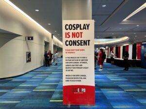 A large sign inside Fan Expo Canada that reads “Cosplay is Not Consent. Please keep your hands to yourself.”