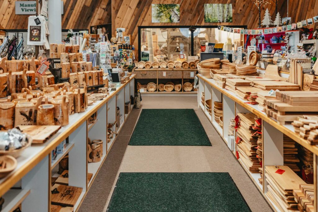 Interior of the Great Alaska Bowl Company store in Fairbanks, Alaska, displaying rows of handcrafted birch bowls, mugs, and cutting boards.