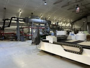 Large pipes and industrial equipment inside the geothermal plant that powers Chena Hot Springs Resort.