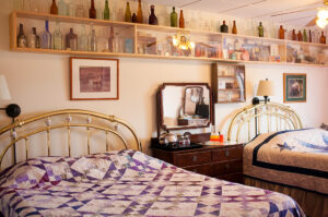Antique beds, furniture and glass furniture adorn the cozy rooms.