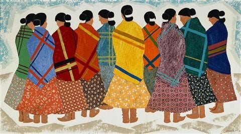 A stylized painting of a circle of Indigenous women standing closely together, seen from behind and in profile. Each woman wears a long patterned skirt and a brightly coloured shawl or blanket in shades of red, orange, yellow, green, blue, and purple, many with bold stripes or checks. Their hair is tied back in buns. The figures are simplified and outlined, creating a sense of unity and community.