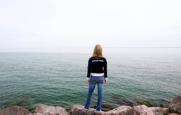 woman looking out at the lake