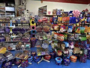 Display of British sweets at the British Emporium, with tubs and racks filled with chocolate bars, toffees and colourful bags of candy.