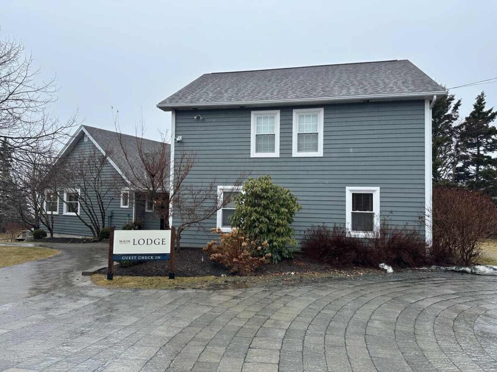 Exterior of the Main Lodge guest check-in building at Oceanstone Seaside Resort in Indian Harbour, Nova Scotia.