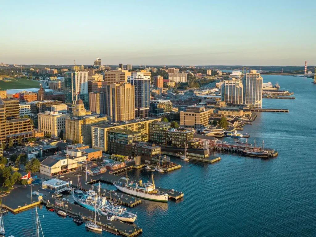 Aerial view of downtown Halifax and the waterfront in warm early morning light.