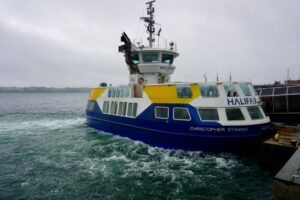 Halifax Transit ferry Christopher Stannix pulling away from the dock on a grey day.