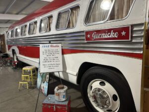Close-up of a 1948 Flxible bus used by the Gornicke family in the film RV, displayed inside the Jack Sisemore Traveland RV Museum.