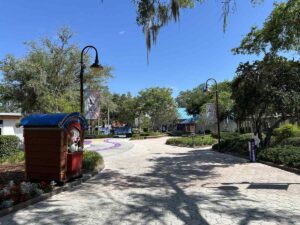 Shaded walkway and colourful pathway through Give Kids The World Village in Kissimmee.