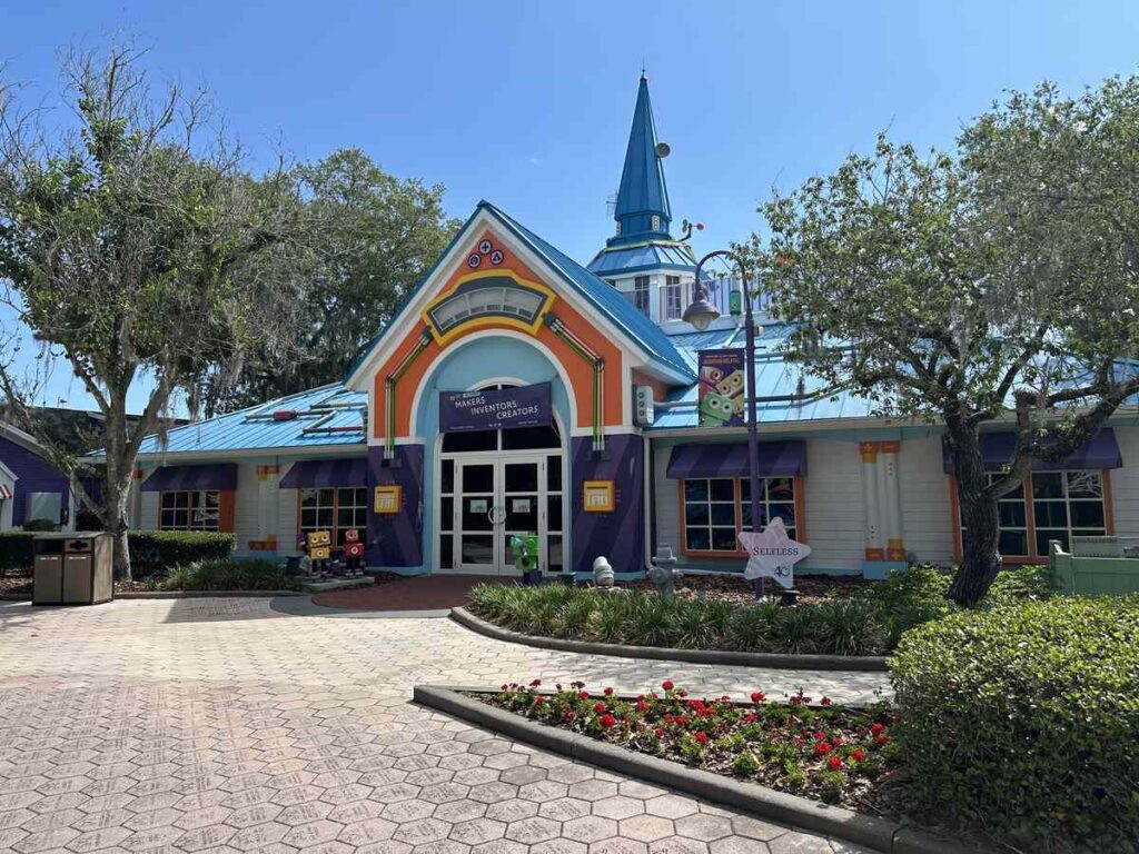 Colourful activity building for makers, inventors, and creators at Give Kids The World Village.