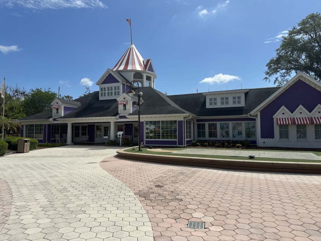 Purple building with a striped tower at Give Kids The World Village in Kissimmee, Florida.