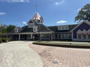 Purple building with a striped tower at Give Kids The World Village in Kissimmee, Florida.