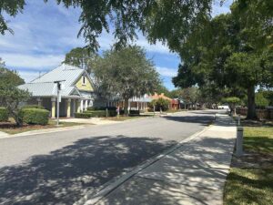 Tree-lined street of colourful villas at Give Kids The World Village in Kissimmee, Florida.