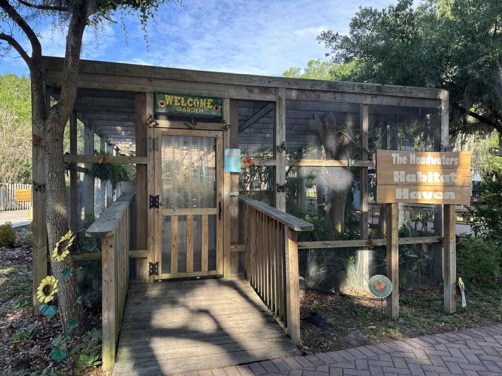 Wooden entrance to the Headwaters Habitat Haven garden at Boggy Creek Airboat Adventures.