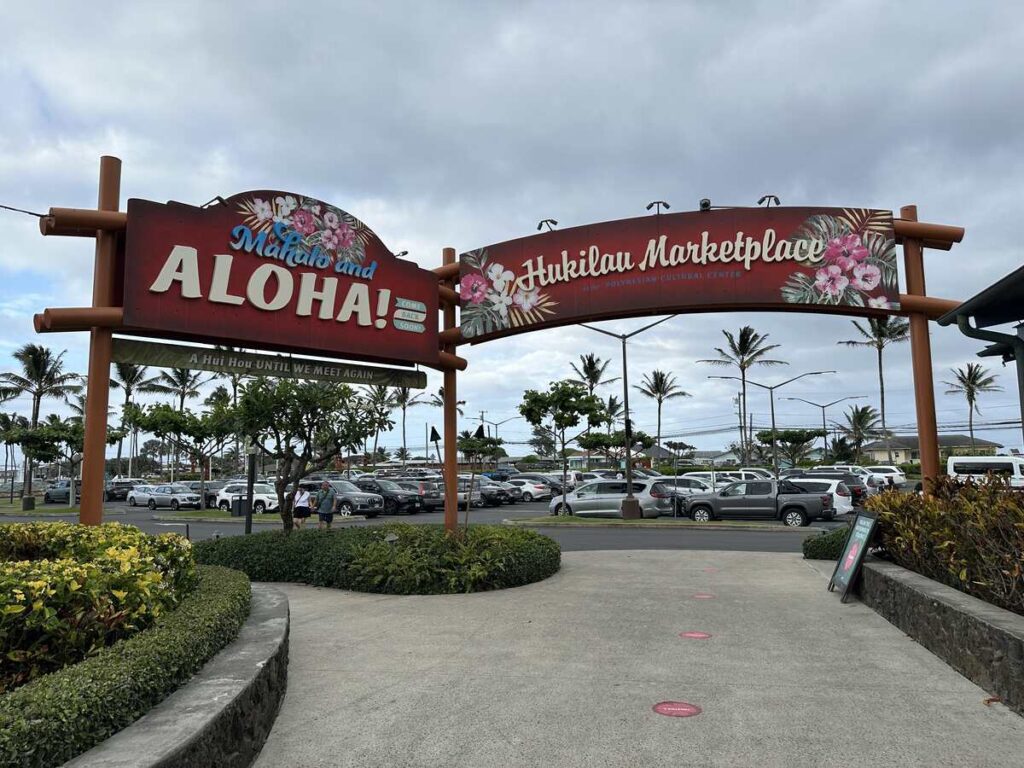 A “Mahalo and Aloha” sign stands near the Hukilau Marketplace entrance at the Polynesian Cultural Center.