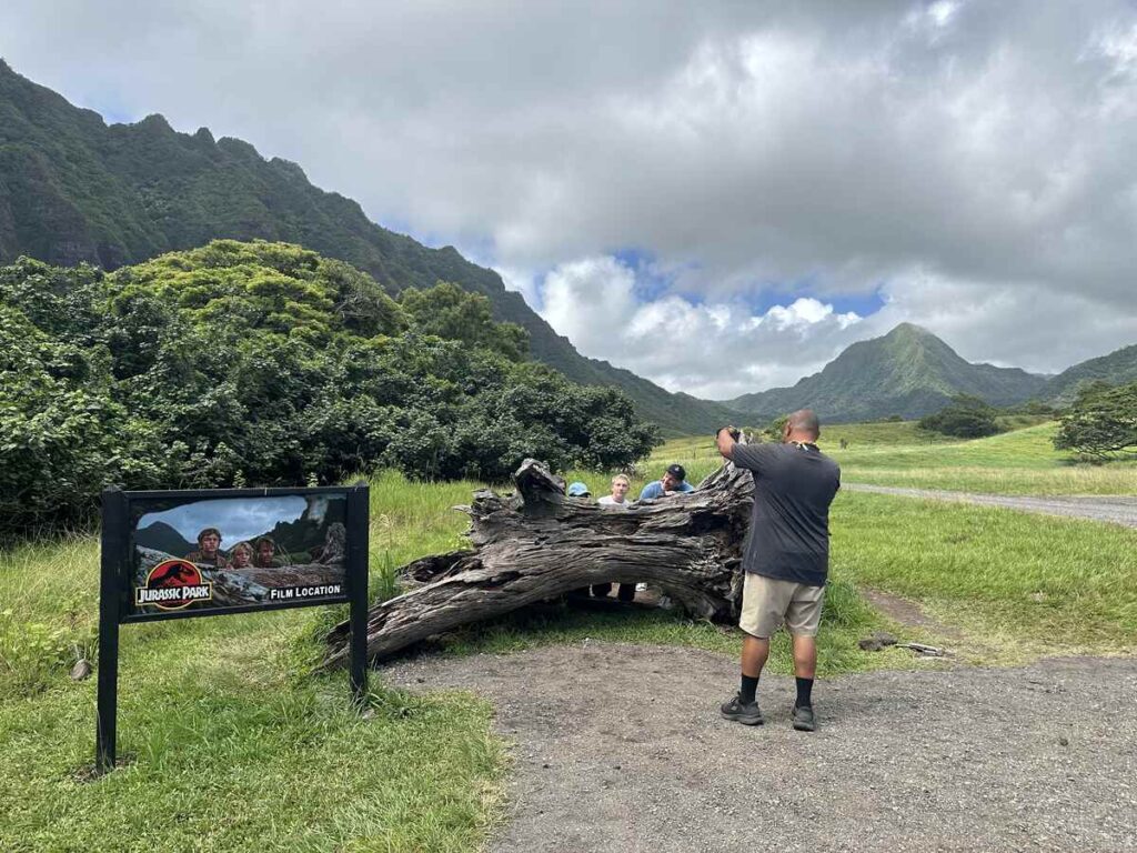 Visitors take photos at a Jurassic Park film location stop at Kualoa Ranch.
